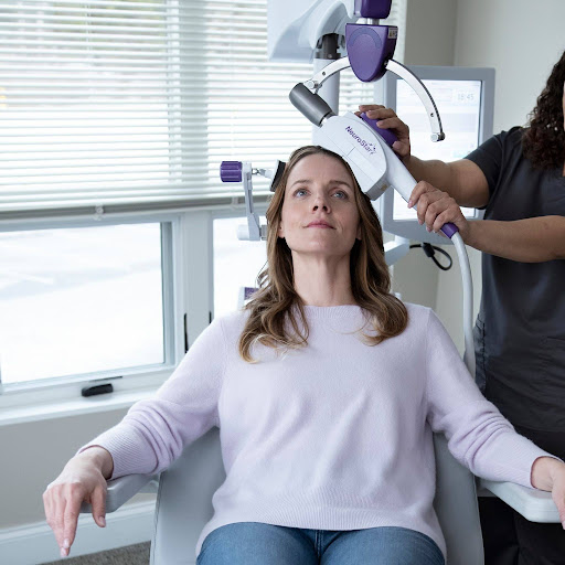 Patient receiving NeuroStar TMS therapy treatment, relevant to how much does TMS therapy cost.
